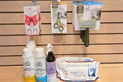 A shelf with various cat grooming supplies available at Tilley's Pet Supplies, one of the best locally owned pet stores in DC & VA.